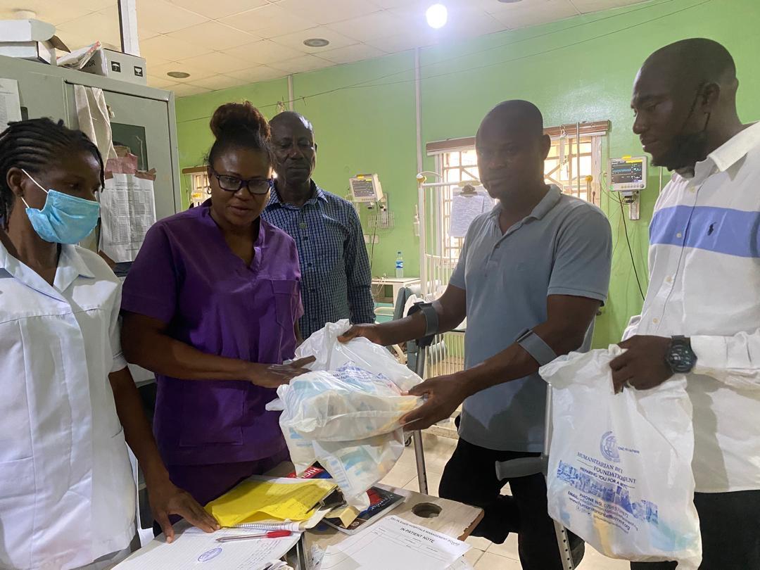 HBF volunteers handing support bags to children's ward staff
